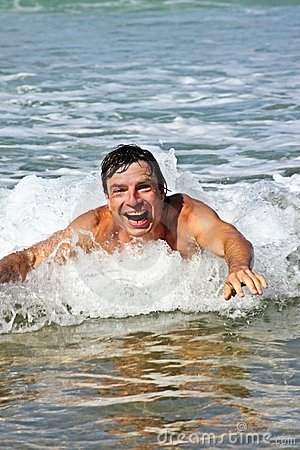 young-guy-enjoying-swimming-ocean-12636627